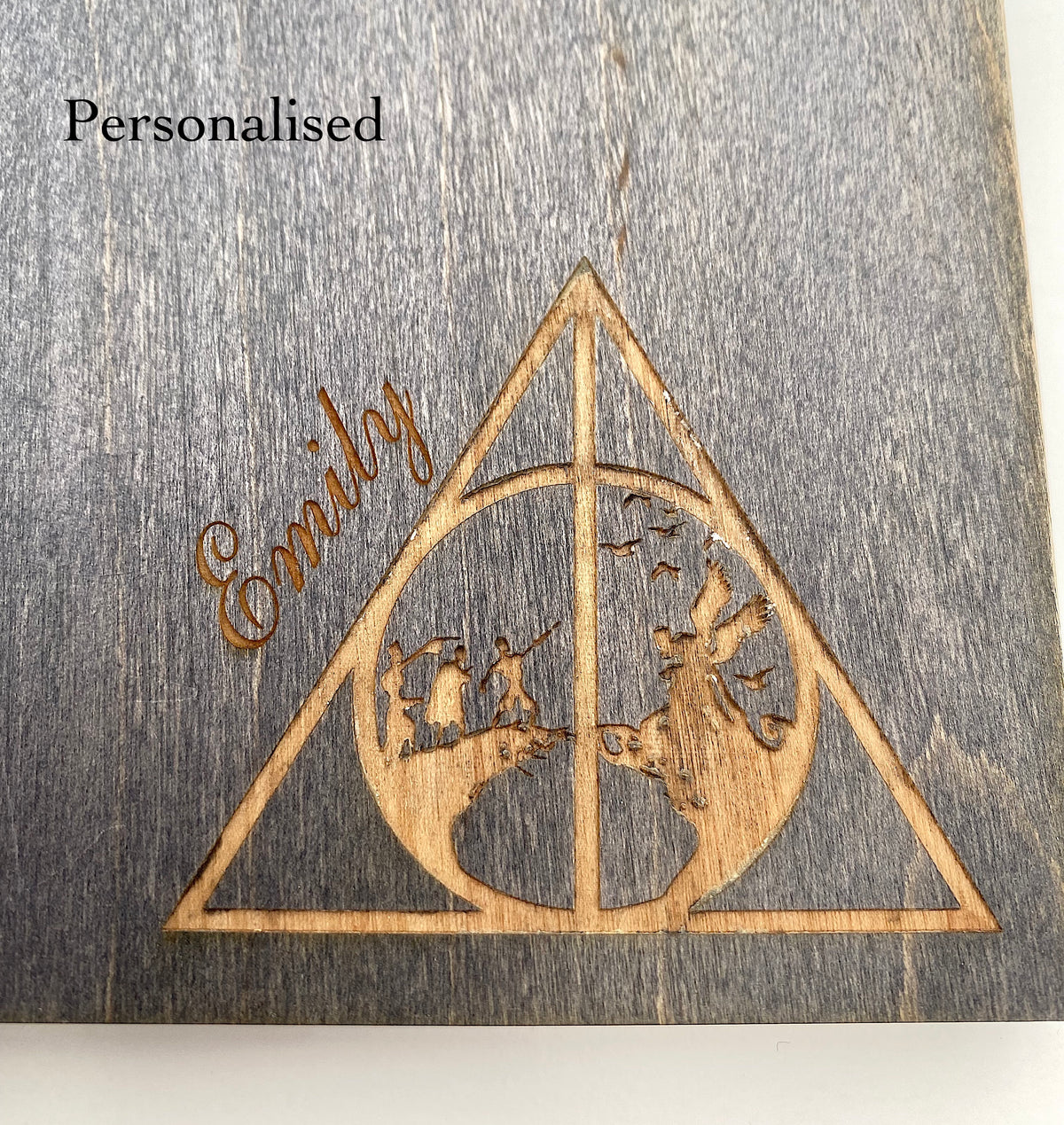 Wooden notebook with a 'Deathly Hallows' design and personalised with 'Emily' engraved.